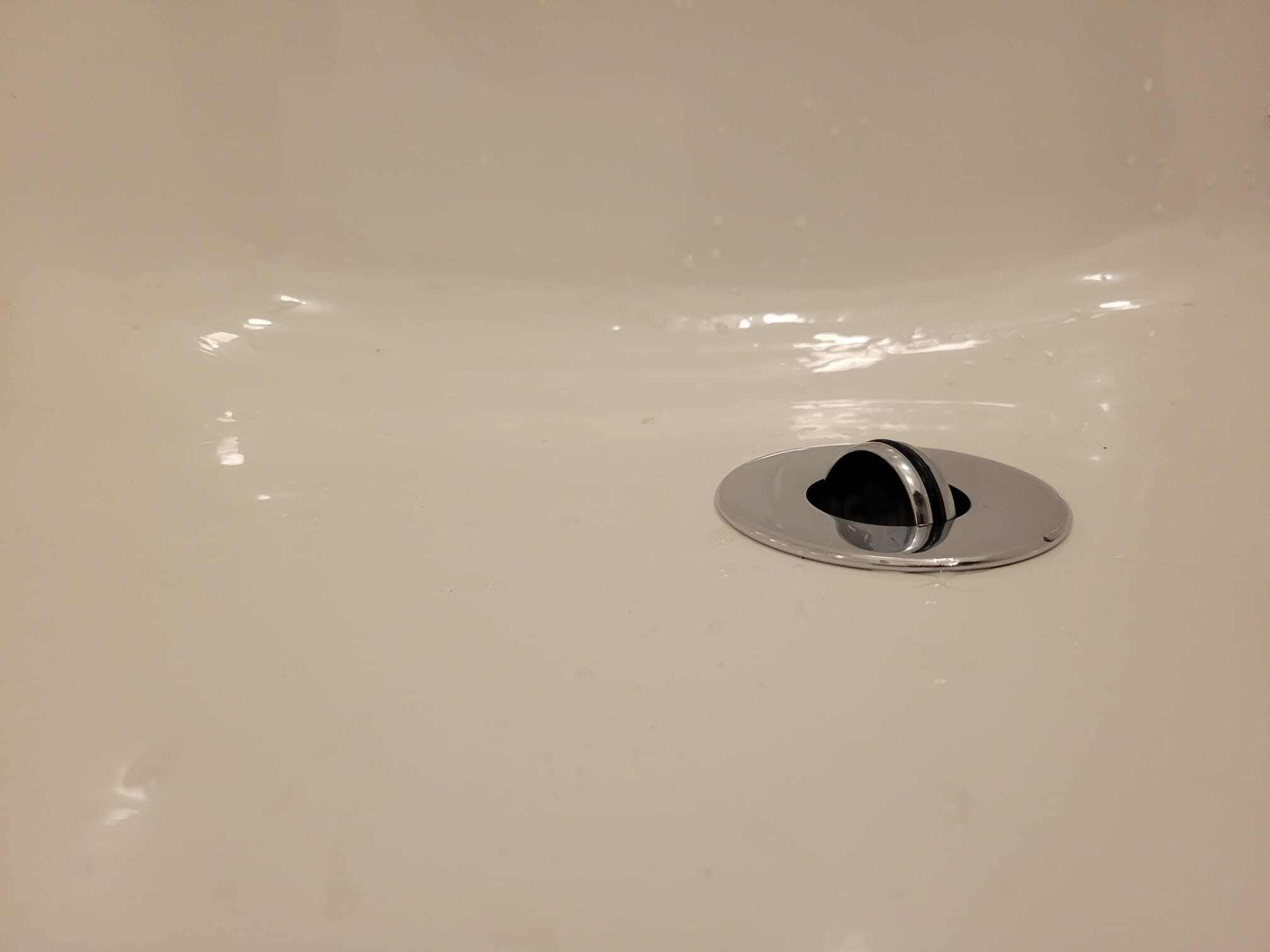 Flip-Turn Drain Cover in Refinished Tub