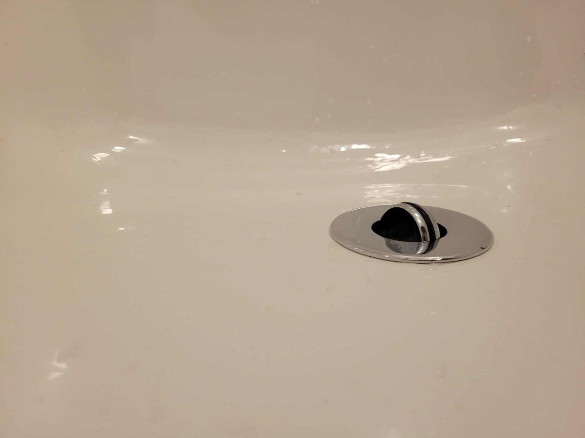 Flip-Turn Drain Cover in Refinished Tub