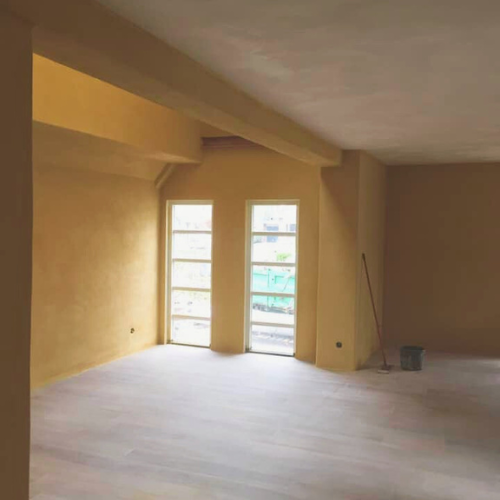 Venetian plaster accent wall with polished marble finish in Montana