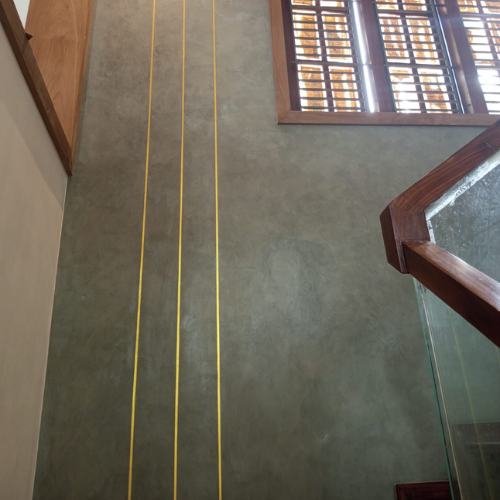 Microcement reveal pattern with textured finish by Heritage Coatings