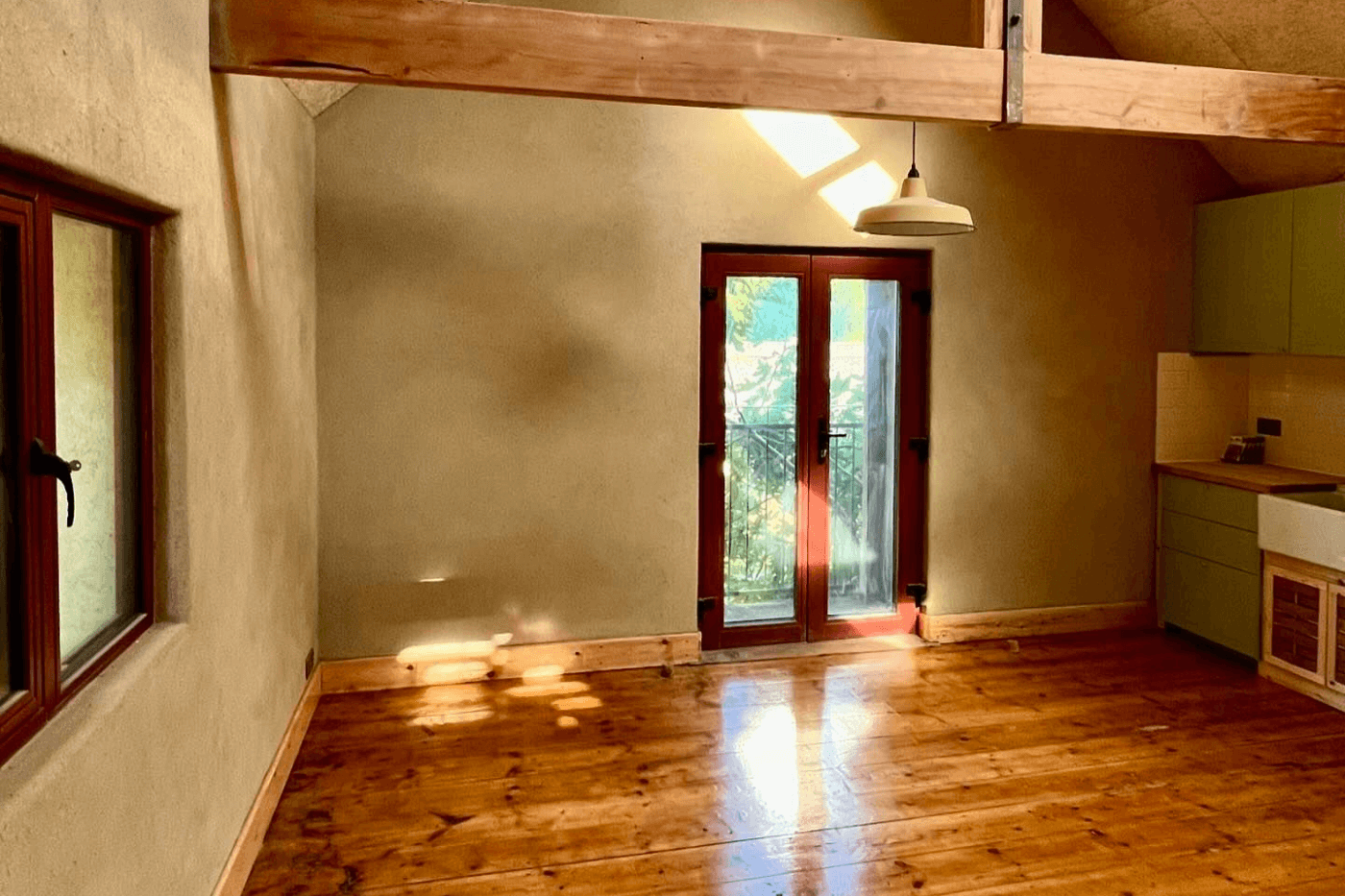 Raw clay plaster studio wall with natural earth-tone finish in Montana
