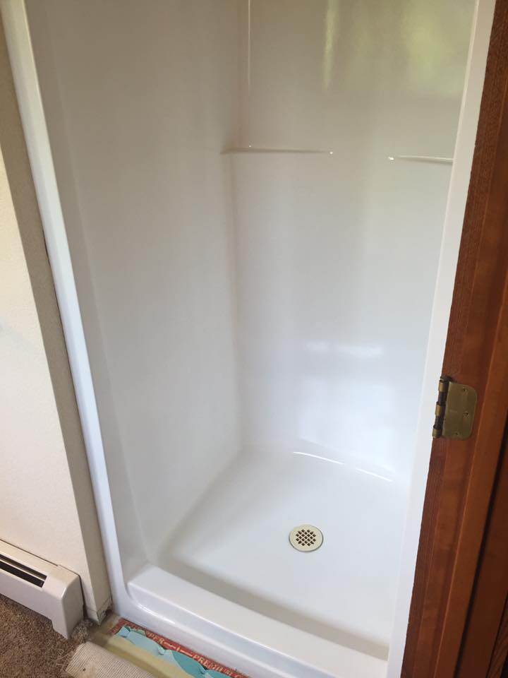 Refinished white single-stall shower by Heritage Coatings in Montana